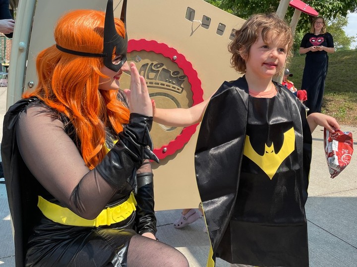  Elizabeth Policicchio, 4, gives a hand bump with Batwoman Lisa Hayes at the John McGivney Children’s Centre Saturday, June 17, 2023, during the Superhero Fun Day.