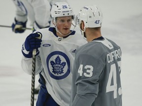 Toronto Maple Leafs Nick Abruzzese (left) talks to teammate Kyle Clifford during practice.