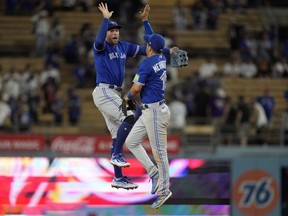 The Toronto Blue Jays announced their spring training schedule for 2024 with 32 games against nine different teams.&ampnbsp;Jays right fielder George Springer, left, and second baseman Whit Merrifield celebrate after a 6-3 win over the Los Angeles Dodgers in a baseball game in Los Angeles, Monday, July 24, 2023.