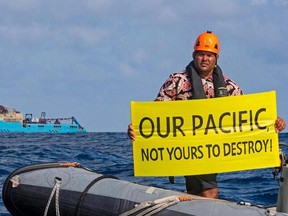 Fijian Greenpeace activist Victor Pickering protests seabed mining tests by Canadian mining company, The Metals Company, in 2021.