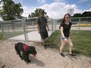Brandon Edwards and Brittany Curtis and dog Dallas check out the newly opened dog park in Amherstburg on Monday, July 3, 2023.