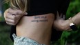 Saira Hansen had a large three-line tattoo of song lyrics written by an ex-boyfriend. Over the years, she has been getting it removed line by line and is now considering getting the final line removed.