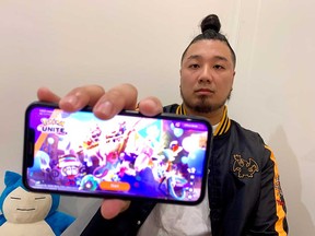 Steve Tran of Windsor shows the video game Pokemon UNITE on his cellphone. Tran is competing in the 2023 World Championships of the game in Yokohama, Japan. Photographed July 27, 2023.