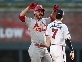 St. Louis Cardinals shortstop Paul DeJong (12) reacts after hitting a double to drive in a run against the Atlanta Braves in the second inning of game five of the 2019 NLDS playoff baseball series at SunTrust Park.