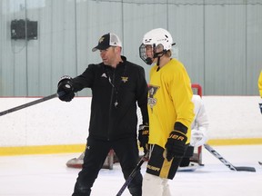New Windsor Spitfires' assistant coach Casey Torres , left, is seen working at his hockey academy with 2008-born prospect Alex Mclean.  Photo credit: Kaitlyn LeBoutillier/Shutter Sports Media