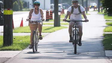 Cyclists make use of the Ganatchio Trail extension in Tecumseh on Aug. 9, 2023.