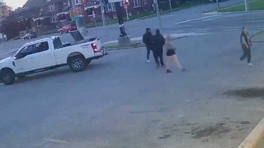 A surveillance camera image showing two males and two females sought by Windsor police in connection with a stolen pickup truck in July 2023.