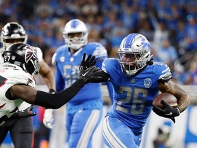 Detroit Lions' running back Jahmyr Gibbs (26) looks to elude a tackle during Sunday's win over the Atlanta Falcons.