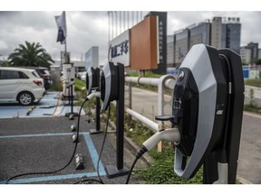 Charging stations for General Motors Co. Buick Velite electric vehicle (EV) stand outside the company's dealership in Shanghai, China, on Wednesday, July 17, 2019. The future for GM in China is in the hands of customers considering whether to go electric. No other country comes close to China, in terms of scale and adoption of new-energy vehicles, where more electric cars have been sold in Shanghai alone than in all of the U.S., U.K., or Germany.