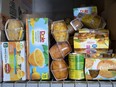 Fruit cups are stacked on a shelf at the Serving Our Kids Foundation warehouse in Henderson, Nev., on Saturday, Sept. 12, 2020. Banning plastics from grocery stores could have unforeseen repercussions on food security, Dr. Sylvain Charlebois writes.