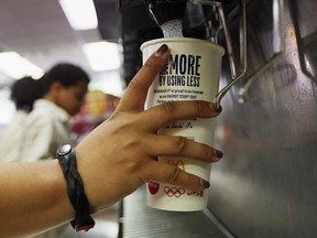 A customer fills a 21 ounce cup with soda at a 'McDonalds' on September 13, 2012 in New York City.