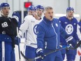 Maple Leafs head coach Sheldon Keefe runs a drill during training camp at the Ford Performance Centre in Toronto, Thursday, Sept. 21, 2023.