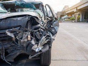 A damaged car is seen following a crash on the road.