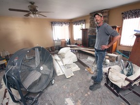 Greg Long amid flood damage