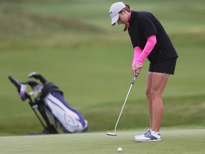 St. Anne Saint's senior Emily Young eyes a putt during the WECSSAA golf championship at the Ambassador Golf Club on Wednesday.