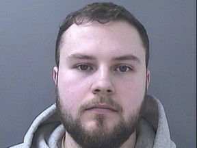 This undated handout photo provided by South Wales Police shows Lewis Edwards. Edwards, a former British police officer, has been sentenced to life in prison with a minimum term of 12 years after he pleaded guilty to over 100 child sex offenses. The crimes included threatening and blackmailing more than 200 young girls into sending him sexual photos of themselves on Snapchat.