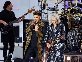 Adam Lambert (centre left) and Brian May of Queen perform during the Platinum Party at Buckingham Palace on June 4, 2022 as part of Queen Elizabeth II's platinum jubilee celebrations. (Photo by HANNAH MCKAY/POOL/AFP via Getty Images)