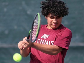 Faraan Faruqi, of McGregor, hits a return during a boys' singles match at the SWOSSAA tennis championship at the Chatham Tennis Club in Chatham, Ont., on Wednesday, Oct. 18, 2023. (Mark Malone/Chatham Daily News)