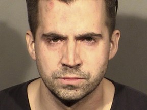 This booking photo provided by the Las Vegas Police Department shows Officer Caleb Rogers in Las Vegas, Feb. 27, 2022.