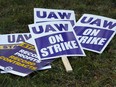 United Auto Workers signs for a strike are shown at the Stellantis Sterling Heights Assembly Plant, in Sterling Heights, Mich., Monday, Oct. 23, 2023.