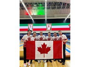 Darren Alexander, far right, and the Canadian men's tenpin bowling team celebrate after winning gold in Kuwait.