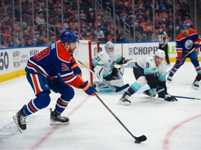 Connor Brown (28) of the Edmonton Oilers, looks for options at the side of the Seattle Kraken net at Rogers Place in Edmonton on Oct. 6, 2023. Photo by Shaughn Butts-Postmedia