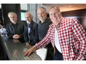 Local businessmen John Savage, left, Stephen Savage, Rocco Tullio and Brian Schwab are part of the new ownership group for the NHL's Ottawa Senators.