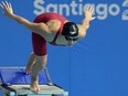 Canada's Maggie Mac Neil prepares to enter the water in the women's 50m freestyle event at the Pan American Games in Santiago, Chile, Tuesday, Oct. 24, 2023.