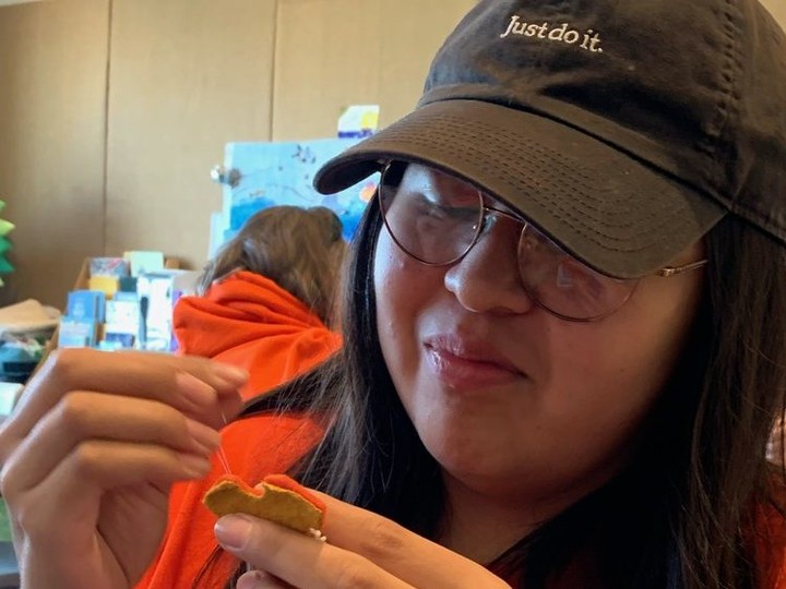  Moraviantown resident Taryn Jacobs, 20, does bead work on an orange shirt pin on Saturday, Sept. 30, 2023, during National Day for Truth and Reconciliation events at Art Windsor-Essex.