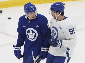 Toronto Maple Leafs John Tavares (left) and Mitch Marner chat on the ice before practice.