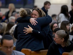 LEWISTON, Maine — Mourners gather at the Basilica of Saints Peter and Paul for a remembrance ceremony on Oct. 29 for those killed and injured when Robert Card opened fire, killing 18 people in two separate locations Oct. 25.