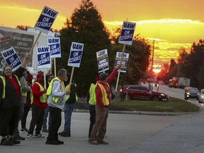 File - UAW local 862 members strike outside of Ford's Kentucky Truck Plant in Louisville, Ky. on Oct. 12, 2023.