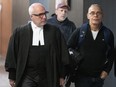 Richard Gauthier, right, a former Canadian pairs skating coach, guilty of sexual assault and gross indecency, arrives for sentencing at the Montreal courthouse with his lawyer, Giuseppe Battista, in Montreal, Monday, Nov. 6, 2023.