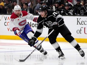 Los Angeles Kings' Alex Laferriere is chased by Canadiens' Tanner Pearson on Saturday, Nov. 25, 2023, in Los Angeles.