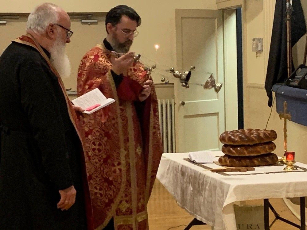 Right Rev. Peter Hrytsyk, left, and Rev. Jaroslaw Lukavenko of St. Vladimir and Olga Ukrainian Catholic Church perform a blessing during a ceremony Sunday, Nov. 26, 2023, at Windsor's Ukrainian National Federation Hall, marking the 90th anniversary of the Holodomor in Ukraine which claimed millions of lives.