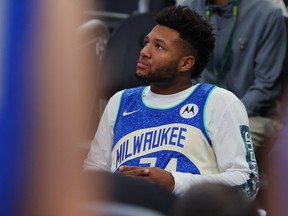 Jackson Chourio of the Milwaukee Brewers watches action during a game between the Milwaukee Bucks and the Atlanta Hawks.