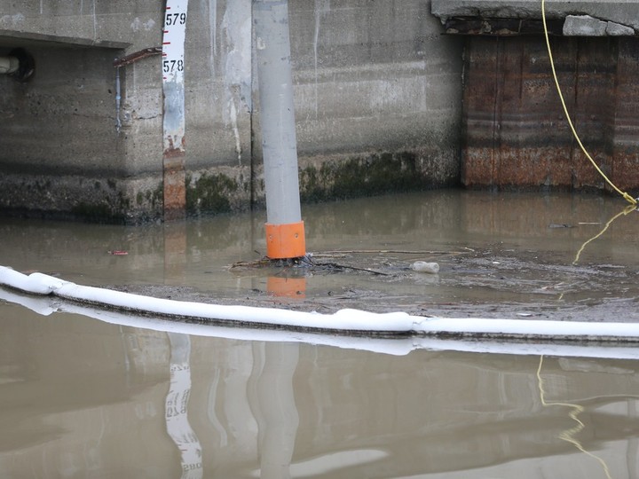  A spill in Little River is contained by booms placed by the City of Windsor near Riverside Drive on Dec. 29, 2023.