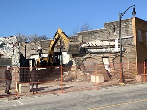 The front of a building on Erie Street North in Wheatley comes crashing down Tuesday morning during demolition of three buildings damaged in an Aug. 21, 2021, toxic gas blast that rocked the downtown. (Ellwood Shreve/Chatham Daily News)