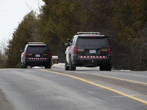 Ontario Provincial Police in eastern Ontario say they've laid a murder charge in a case that began as a missing person's investigation last month. OPP vehicles are seen during work in Beckwith, Ont., Friday, Feb. 10, 2023.