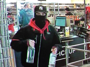 Sarnia police released this surveillance photo of a suspect sought after an assault and theft at a Sarnia liquor store Saturday (Supplied)