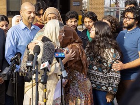 Tabinda Bukhari, the mother of Nathaniel Veltman murder victim Madiha Salman, is hugged by a supporter after speaking to reporters outside the Windsor courthouse on Nov. 16, 2023. (Mike Hensen/The London Free Press)