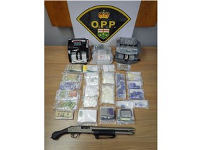 Officers from the OPP, London police and Woodstock police seized drugs valued at $194,000, a shotgun and cash in searches of five properties and three vehicles in five Southwestern Ontario communities on Tuesday, Jan. 9, 2024, the OPP says. (OPP photo)