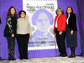 Canada Post's Brandy Ryan, left, joins Mary Ann Shadd's descendants Adrienne Shadd, Brenda Edmonds Travis and Marishana Mabusela as the Mary Ann Shadd stamp is unveiled at The Kent in Chatham Tuesday. (Ellwood Shreve/Chatham Daily News)