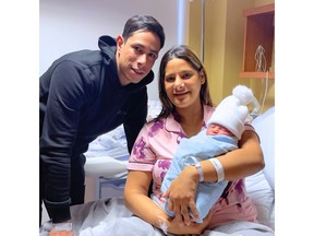 Zoila Ruiz Alceda and Jose Gonzalez with their baby Derek
