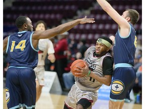 Windsor Express guard Ja'Myrin Jackson gets double teamed by the Montreal Toundras' Antoine Mason, left, and Philip Flory during Friday's game at the WFCU Centre.