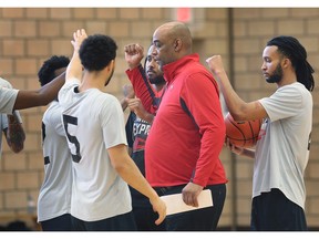 Windsor Express head coach Bill Jones gathers with his players at practice ahead of the team's BSL opener on Friday at the WFCU Centre.