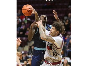 The Montreal Toundras' Mouhamadou Dioum, left, battles for the ball with the Windsor Express' Ty Groce during Friday's game at the WFCU Centre.