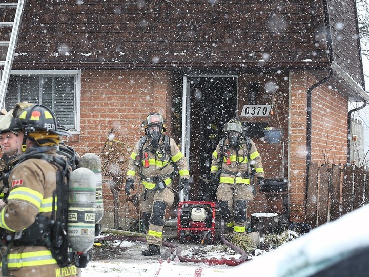  Windsor firefighters are shown at the scene of a townhouse fire on Tuesday, January 30, 2024 in the 6300 block of Thornberry Crescent.