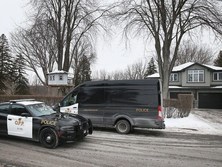  Ontario Provincial Police vehicles are shown outside a residence on Orford Street in LaSalle on Monday, Jan. 22, 2024. Police officials say their presence was related to a weekend homicide investigation in Lakeshore.