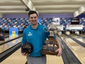 Darren Alexander poses with the Open Division championship trophy after winning his fourth title at Saturday's 68th Molson Masters Bowling Tournament at Revs Rose Bowl.